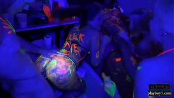 College teens glow in the dark orgy party in a dorm room